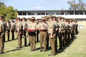 Australian Army Brigadier Simon (Don) Roach, AM presents the brevet to soldiers from 20th Regiment, Royal Australian Artillery at a Brevet presentation ceremony at Gallipoli Barracks, Brisbane, Queensland. 20th Regiment, Royal Australian Artillery soldiers and officers qualified as Operators of Category 3 and higher Uncrewed Arial Systems (UAS) are recognised for their skills and proficiency with the presentation of the very first Brevet to UAS Operators on parade at Gallipoli Barracks, 